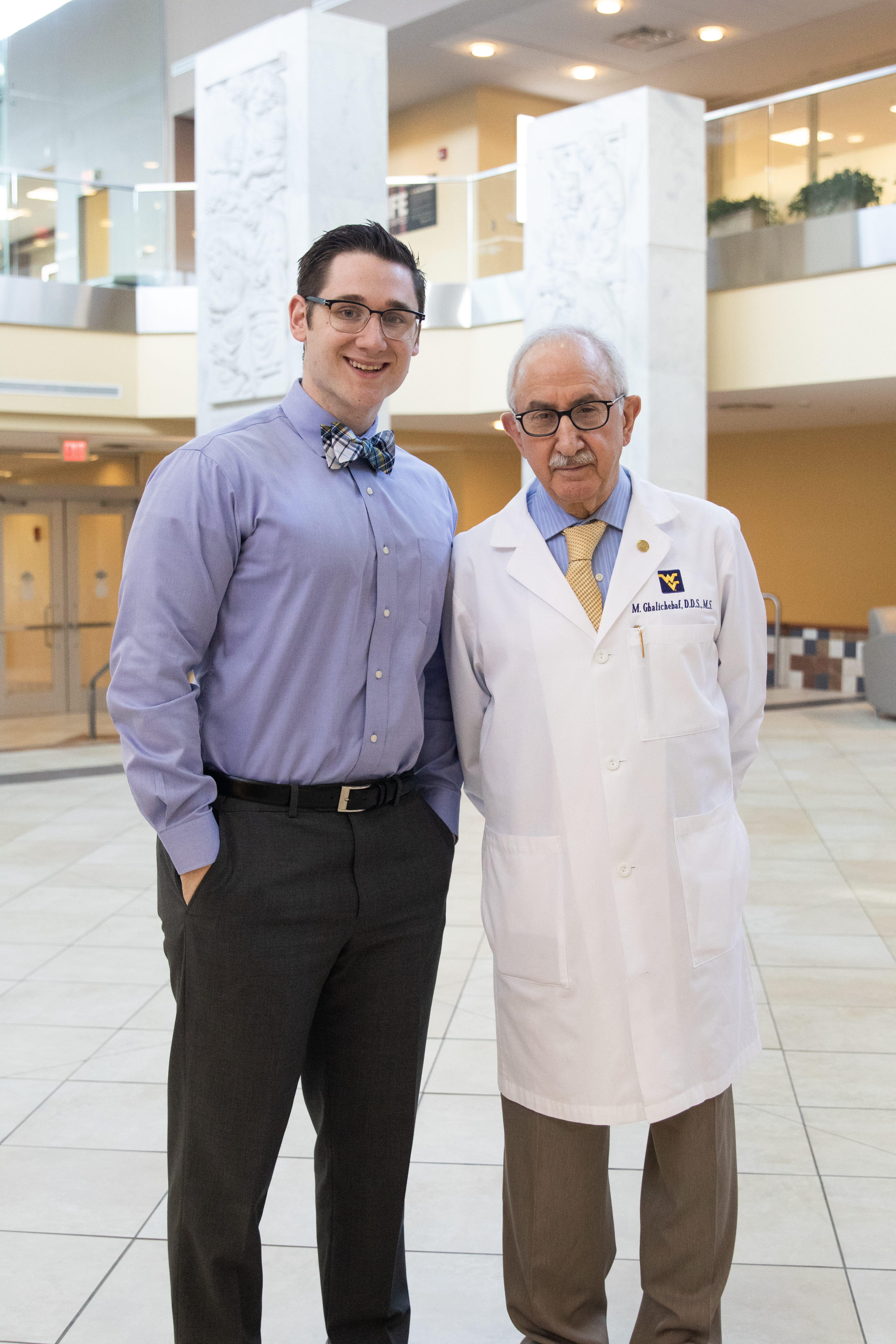 Dr. Harper and Dr. Ghalichebaf pose in the Health Sciences Center.